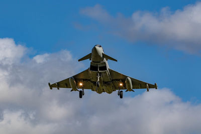 Low angle view of airplane against sky