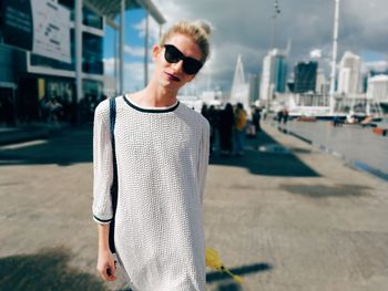 Young man wearing sunglasses standing outdoors