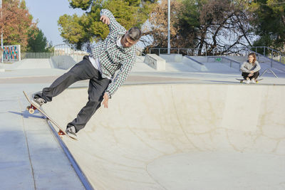Man skateboarding in park