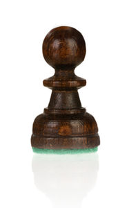 Close-up of chess pieces against white background