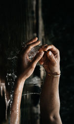 Close-up of man hand in water