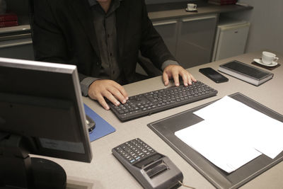 Man using laptop on table