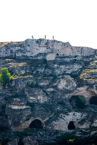 Low angle view of rock formation against clear sky