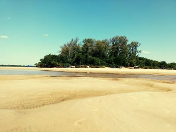 Scenic view of beach against clear sky