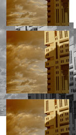 Digital composite image of modern buildings against sky