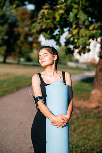 Young woman standing on field