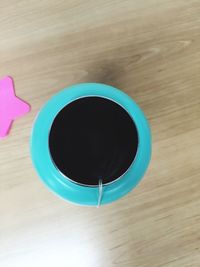 Directly above shot of coffee cup on table
