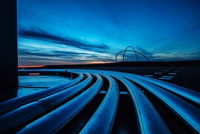 Light trails on blue sky at night