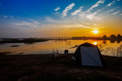 Scenic view of lake against sky during sunset