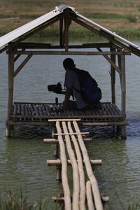 Man with fishing net in water