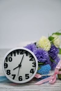 Close-up of clock against blue background