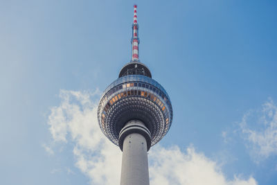 Low angle view of communications tower against sky