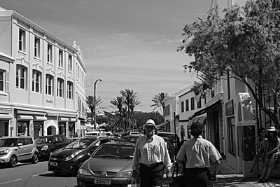 Rear view of man walking on street