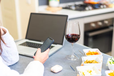 Close-up of wine glasses on table