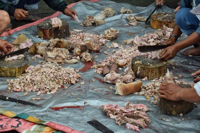 High angle view of people in fish for sale at market stall