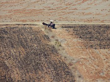 High angle shot of agricultural vehicle on landscape