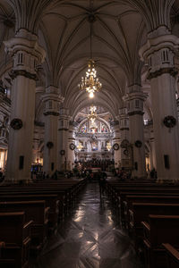 Interior of illuminated old baroque building church 