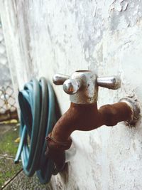 Close-up of faucet on wall