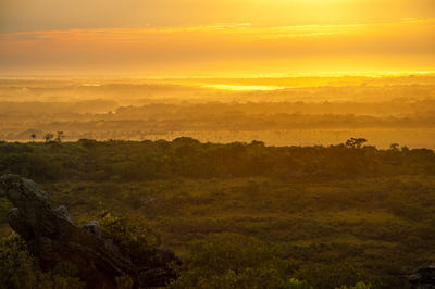 Scenic view of landscape against dramatic sky