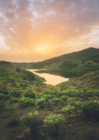 Scenic view of landscape against sky during sunset