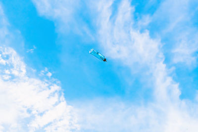 Low angle view of birds flying in sky
