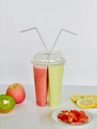 Fruits in glass on table