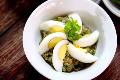 High angle view of food with garnishing of egg slices in bowl