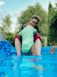 Rear view of two girls in swimming pool