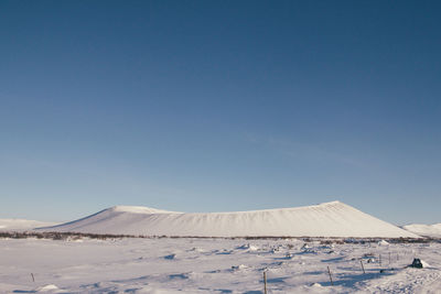 View of desert against blue sky