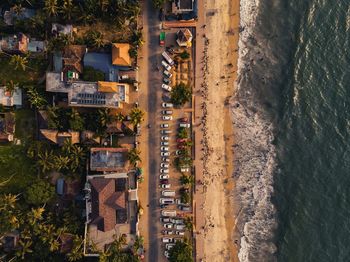 Birds eye view of street amidst buildings in city at the beach