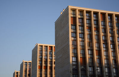 Low angle view of buildings against clear sky