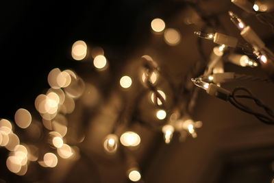 Close-up of illuminated string lights during christmas at night