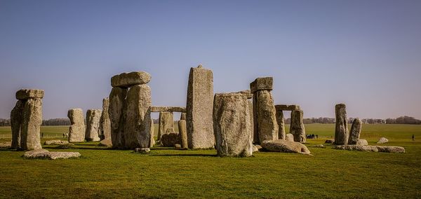 View of old ruin on field against sky