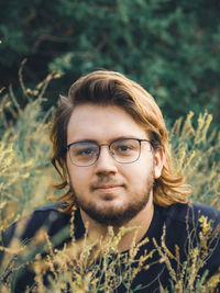 Portrait of a young man in the grass