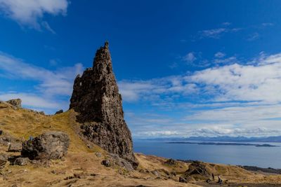 Low angle view of rock formations against sky