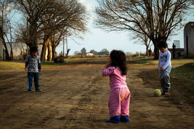 Full length of girl standing in park