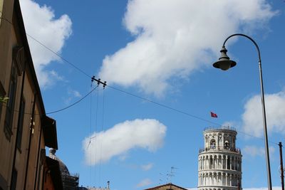 Low angle view of building against cloudy sky