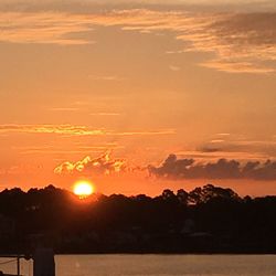 Scenic view of sunset over river