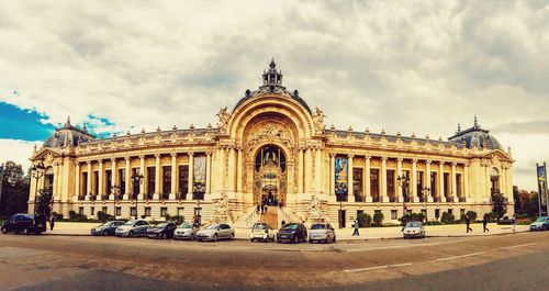 Building exterior against cloudy sky