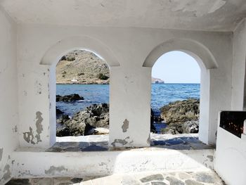 Sea seen through window of building