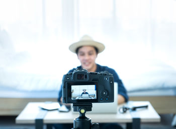 Portrait of man photographing