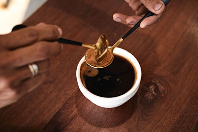 Cropped hand of person working on table