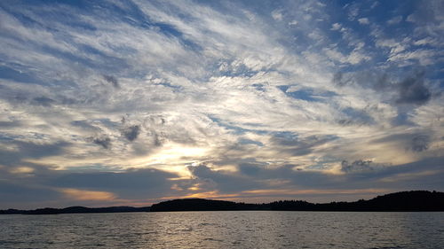 Scenic view of lake against sky during sunset