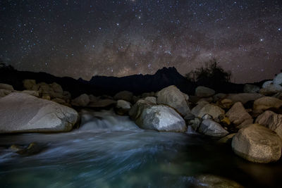 Scenic view of rocks at night