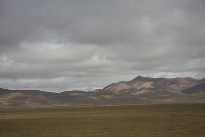 Scenic view of landscape and mountains against sky