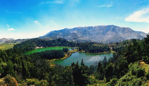 Scenic view of lake and mountains against sky