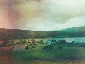 Scenic view of lake against cloudy sky