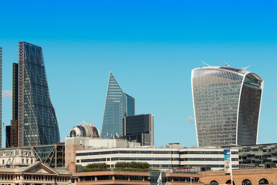 Low angle view of buildings against clear sky