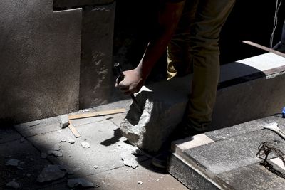 Low section of man working on concrete