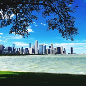 Sea and buildings against sky